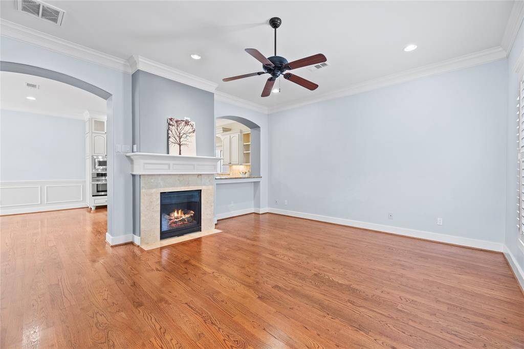 The inviting fireplace becomes a focal point that anchors the room and invites people to gather and linger, making it a cherished feature of the living area.