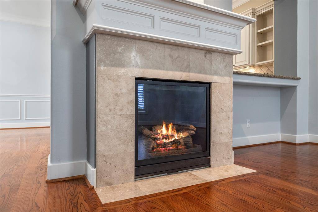 The design of the fireplace itself can also contribute to the overall aesthetic of the room, with a traditional hearth and mantle for displaying photos and decor.