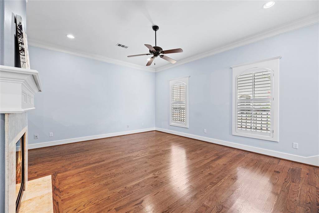 This chic living room space has a great feel with tons of natural light coming from the wall of windows.