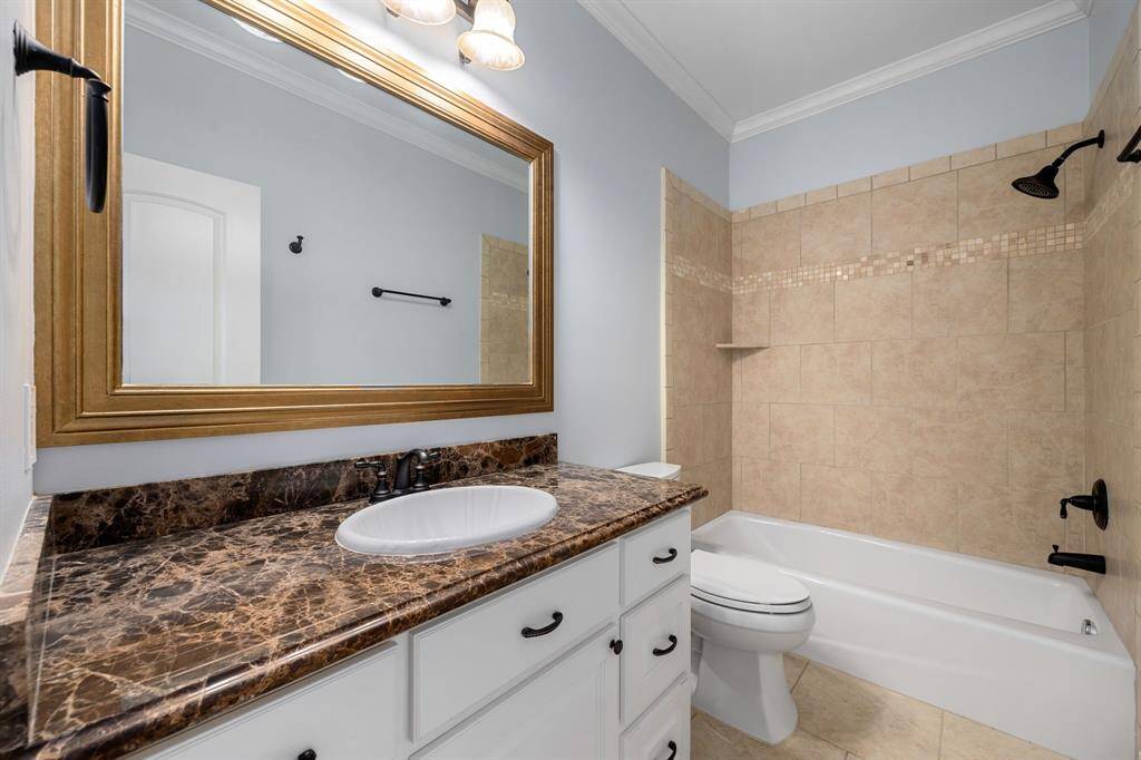 The full secondary upstairs bath.