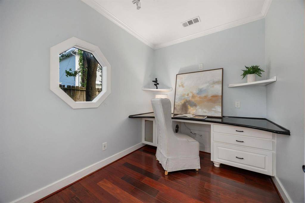A private study through double glass doors adds a touch of sophistication and privacy to the home. It suggests a space dedicated to concentration, creativity, and productivity.