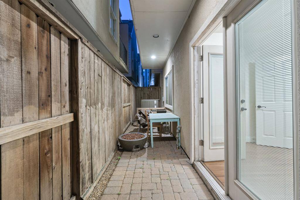 View of the gorgeous property with wrought iron gate entry.
