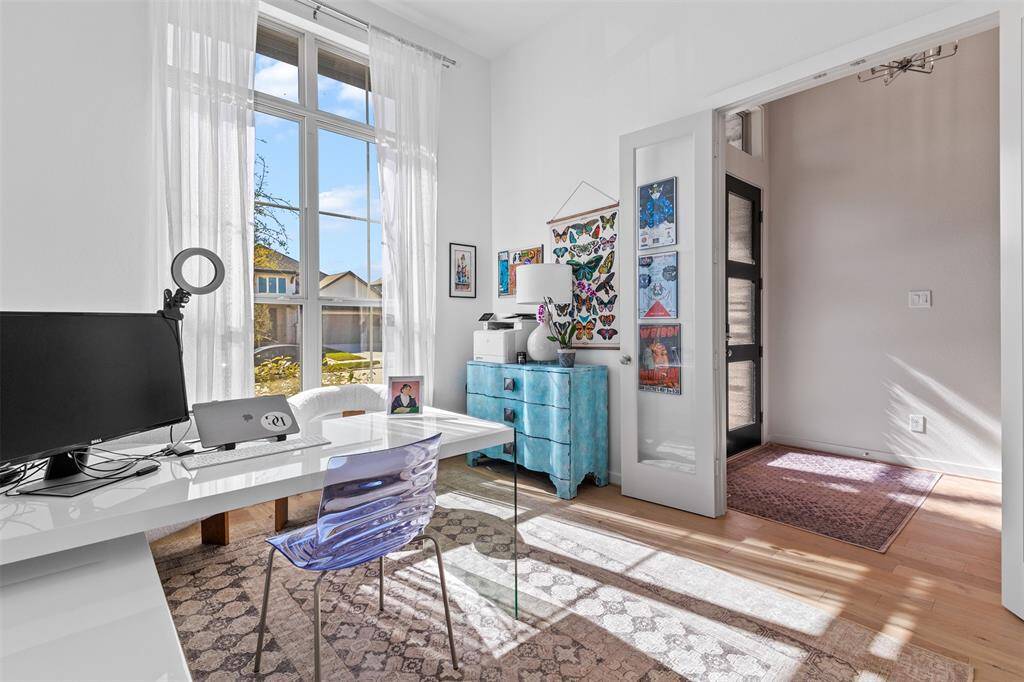 Opposite view of the office showing the French doors that can be closed for privacy for those important work calls.