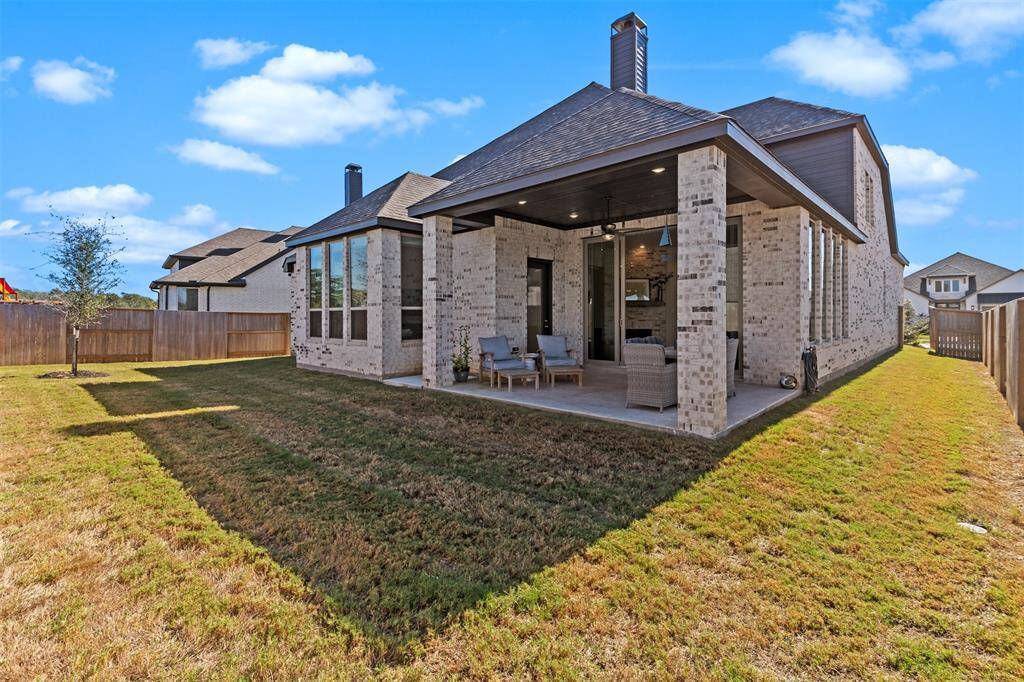 View of back of house and back and side yards.