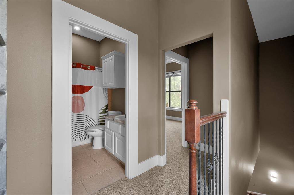 Smaller guest bathroom and back bedroom.
