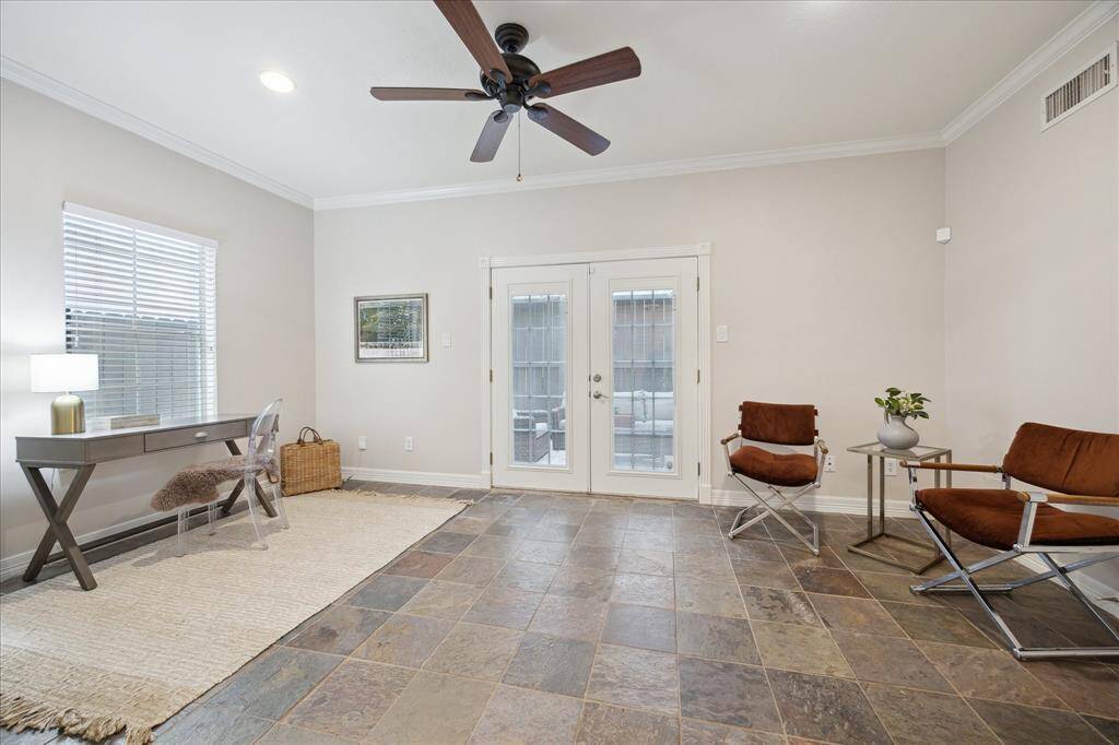 Secondary bedroom with a view of the covered patio