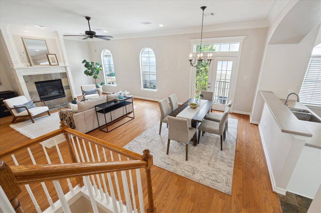 Extra wide staircase, hardwood floors, and gas fireplace.