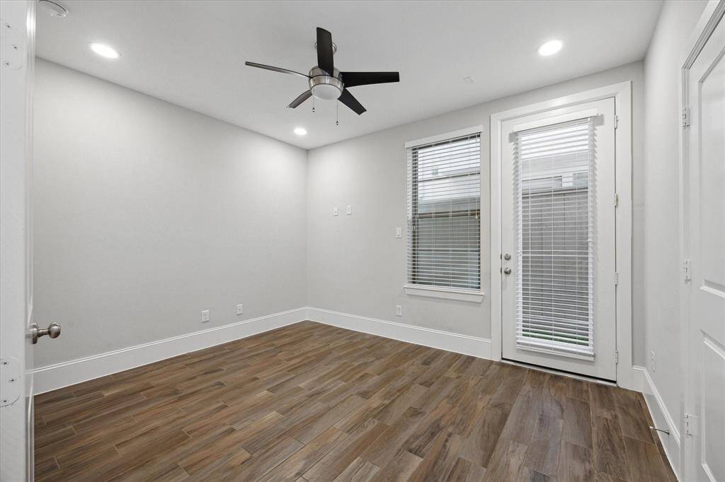 The first-floor bedroom offers flexibility as a private guest suite or home office, complete with its own en suite bath and direct access to the outdoor patio—perfect for morning coffee or a separate entrance for guests.