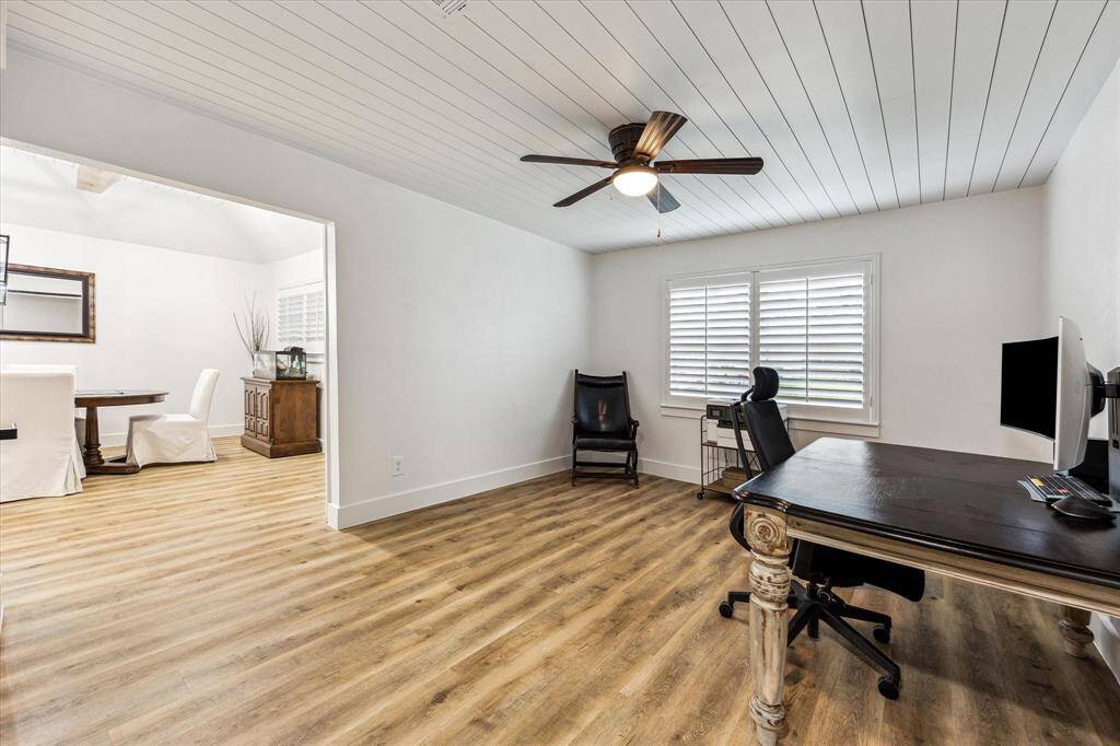 One of the bedrooms now serves as a private Study with the addition of a 15-lite French barn door.