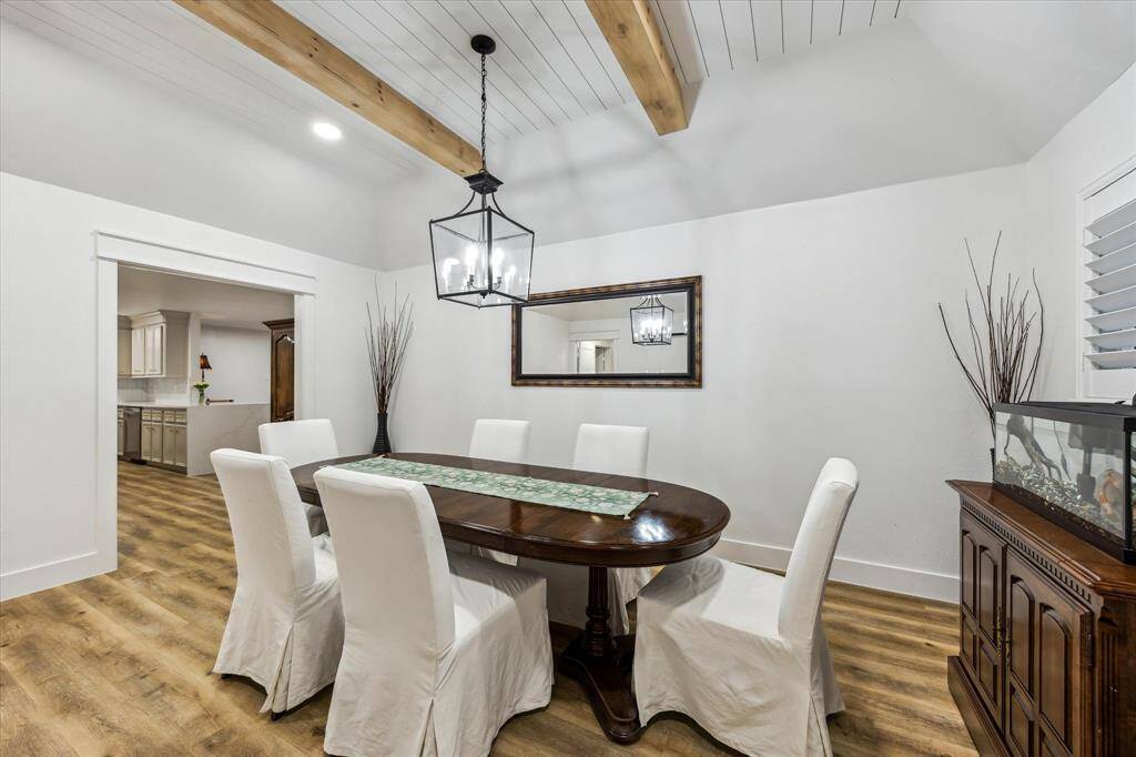 Raised ceiling w/ stained beams at the Dining Room