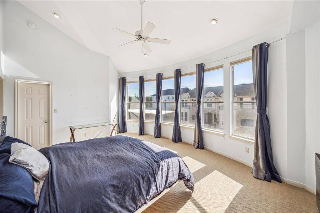 Primary Bedroom – 19 x 14:  The primary suite offers cathedral ceilings, a spa-like bath, walk-in closet, wall to wall windows, and elegant drapes, adding privacy and style.  Carpeted flooring, ceiling fans, recessed lighting and baseboards