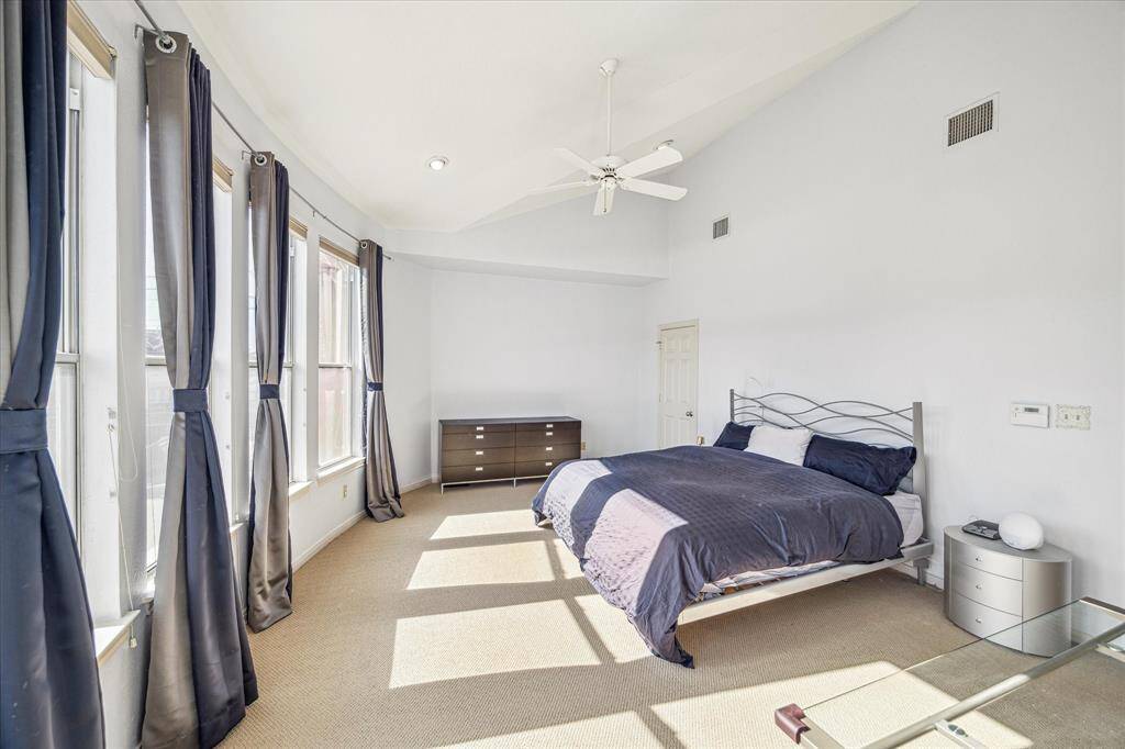 Primary Bedroom - 19 x 14:  Another view of the primary suite with ensuite bath.  Soaring ceilings and tons of natural lighting.