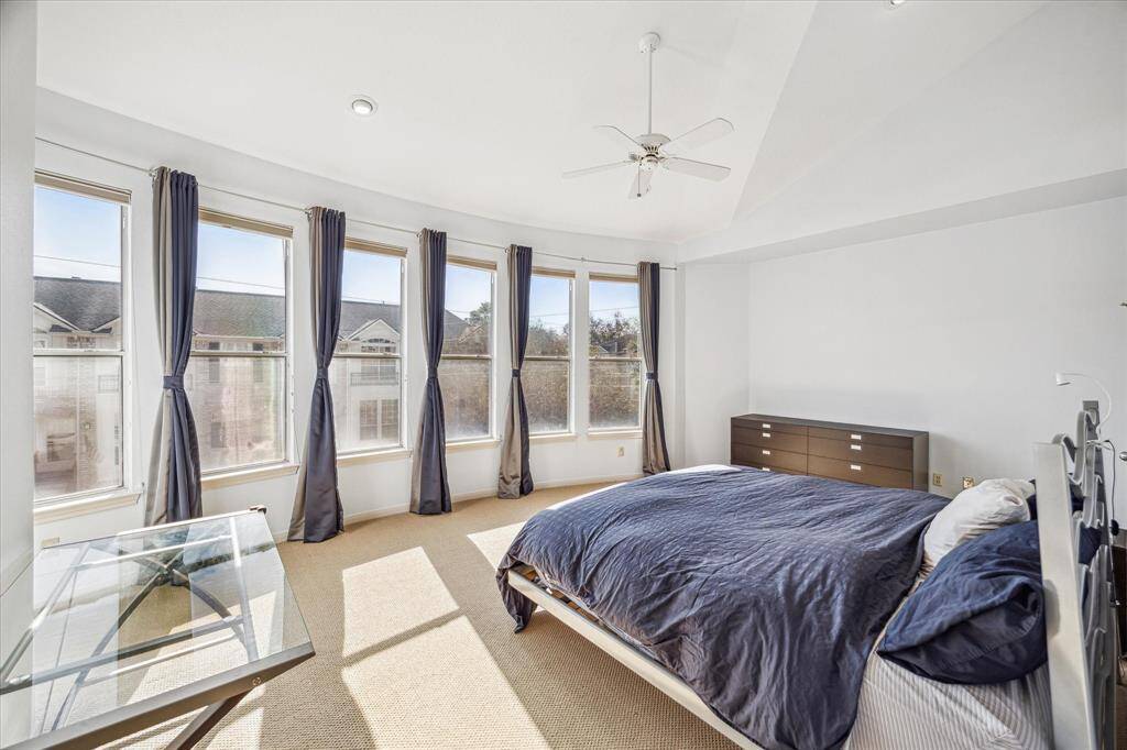 Primary Bedroom – 19 x 14:  Another view of the primary suite showcasing wall to wall windows.