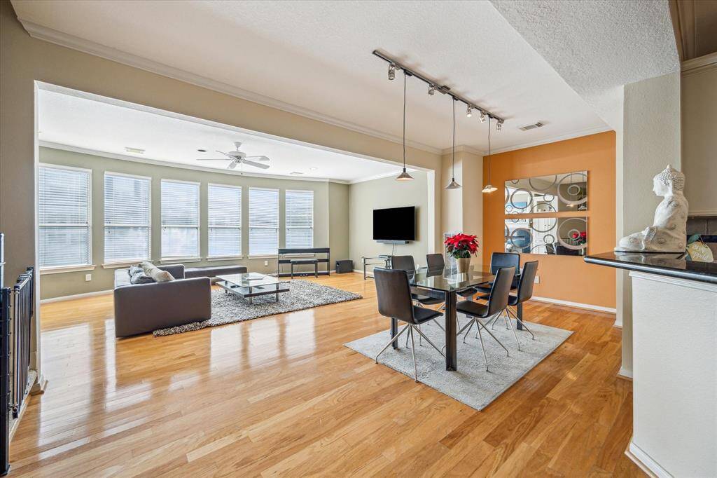 Dining Room - 14 x 10:   Light, bright and spacious dedicated dining room with room to accommodate an oversized dining room table.  Opens to living room.  Wood floors, base boards with quarter round and crown molding.