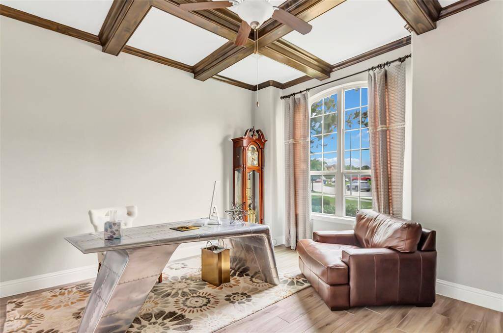 This spacious room features large windows for natural light.