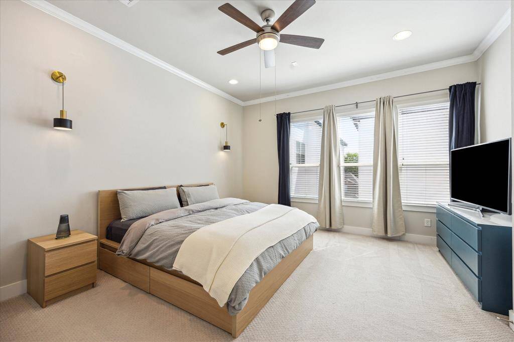 Luxurious third story primary suite with natural light.