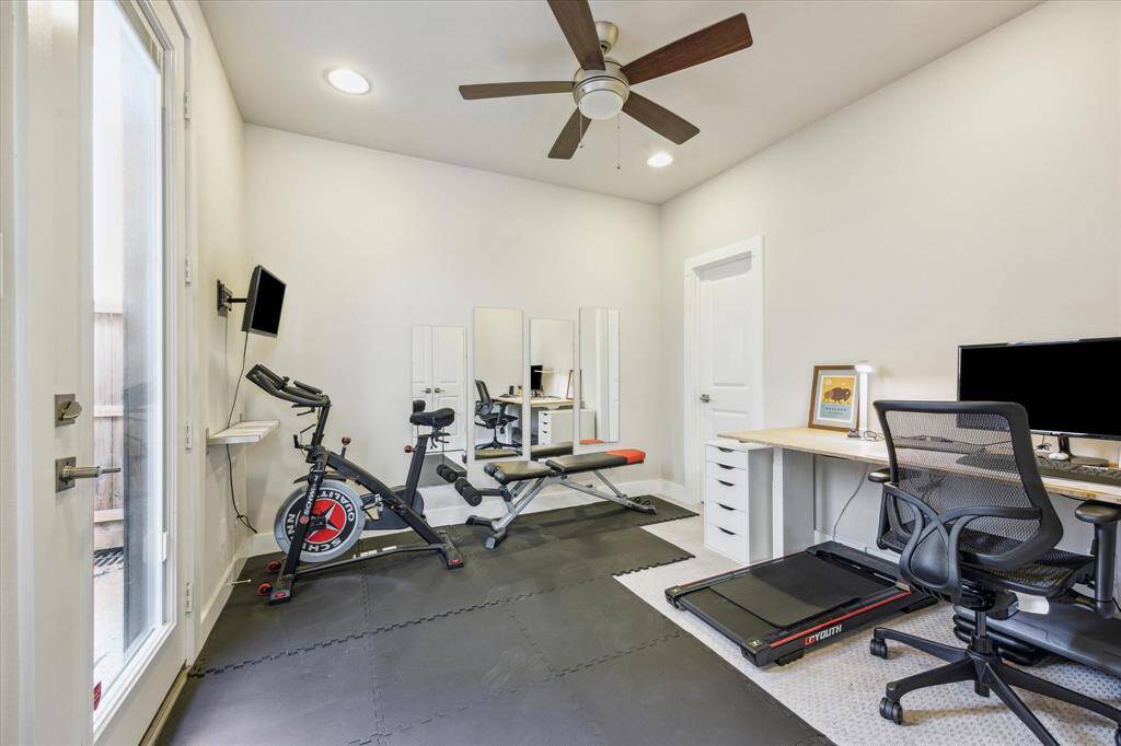 This is a secondary bedroom on the main level that is currently being used as a work out room.