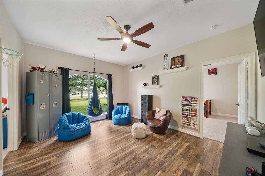 This Game room/Flex area separates two secondary bedrooms and is perfect for meeting in the middle for play dates! Could be a workout / media or flex space as well.