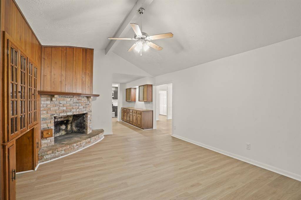 The inviting fireplace becomes a focal point that anchors the room and invites people to gather and linger, making it a cherished feature of the living area.