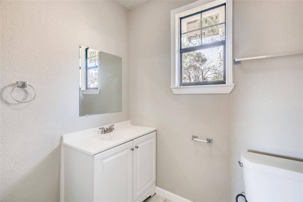 Updated master bathroom with new vanity and fixtures.