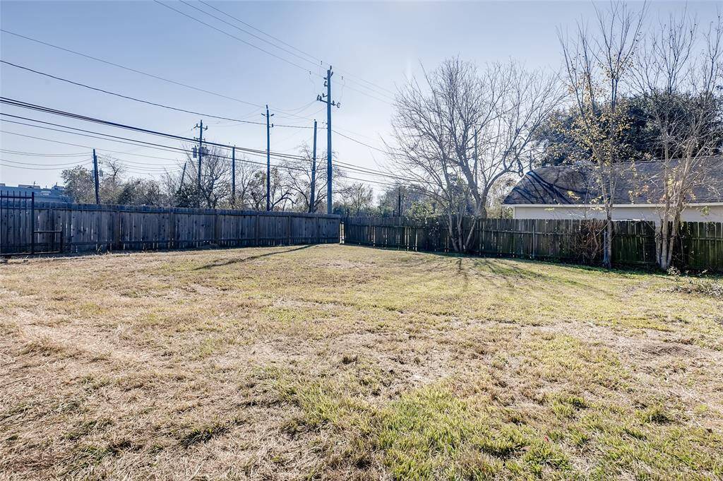 Alternate view of the front yard. Notice the wrought iron gate on left of the picture. Remote access opener to be installed.