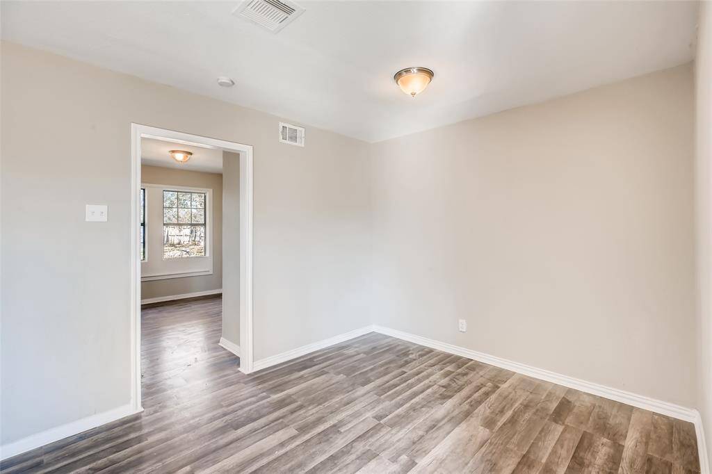 Dining room with entrance into the kitchen.