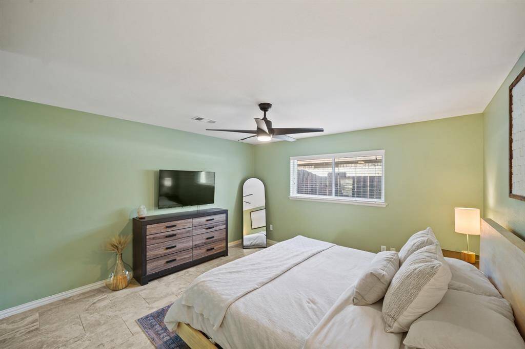 Primary bedroom located just off the family room with en suite bath.