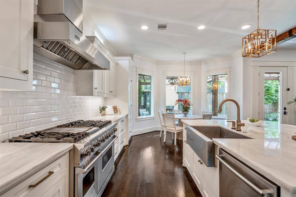 Understated yet bold, the kitchen’s Viking gas range is framed by classic subway tile backsplash and custom cabinetry, making gourmet cooking both inviting and inspiring.