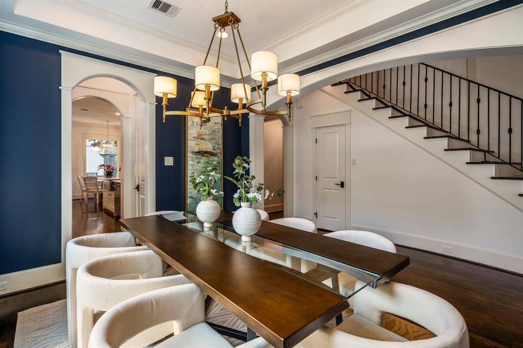 The dining room opens into the foyer with effortless flow, offering a view of the staircase and easy access to the butler’s pantry for seamless entertaining, ideal for both holiday hosting and casual family dinners.