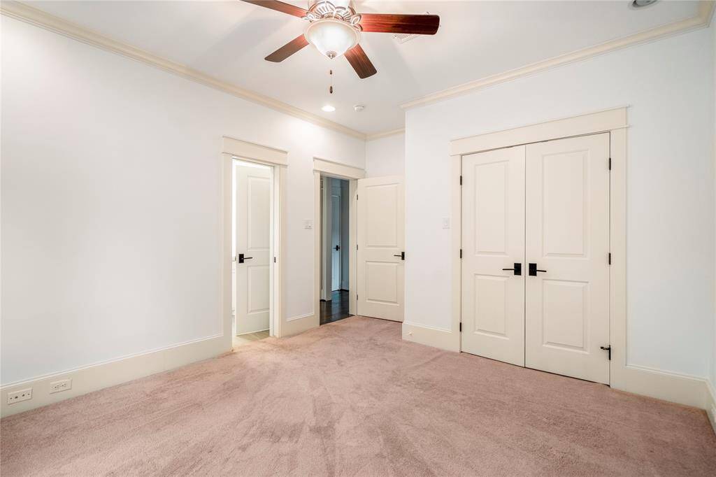 Tucked away for extra privacy, this guest bedroom with its own ensuite full bathroom offers peaceful views and a spacious layout which is perfect for visitors, a home office, or flex space.