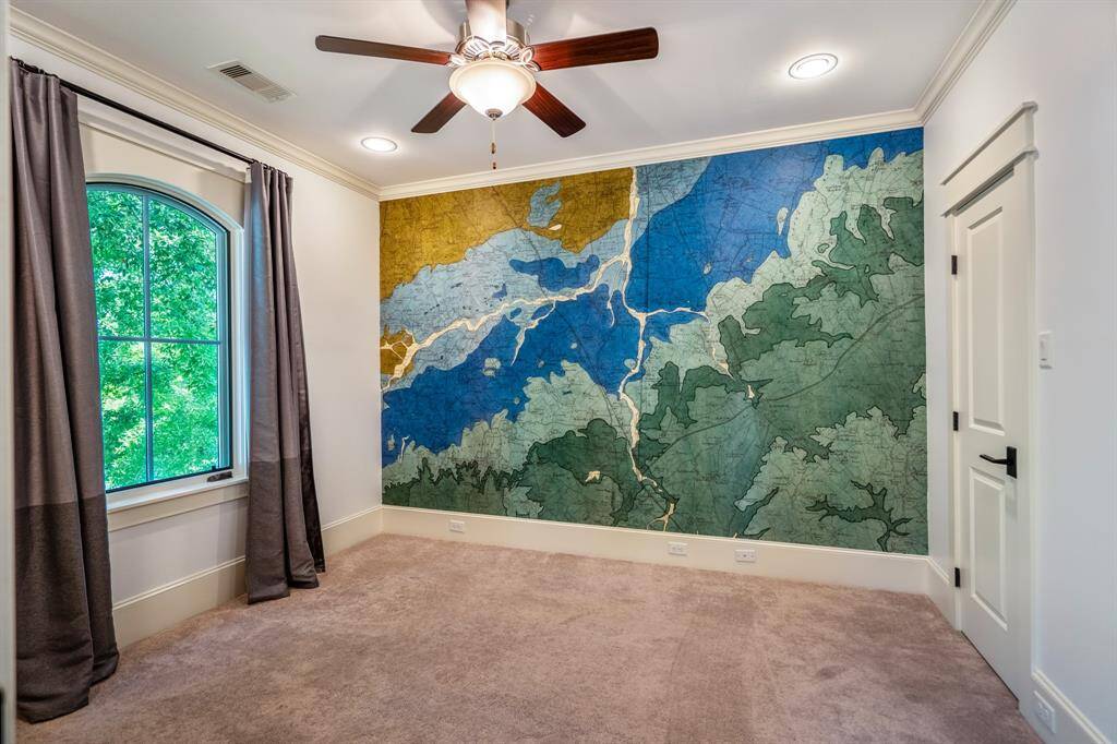 This sunny secondary bedroom is ready for whatever you dream up, whether it's a storytime hideout, superhero headquarters, or just a really great nap.