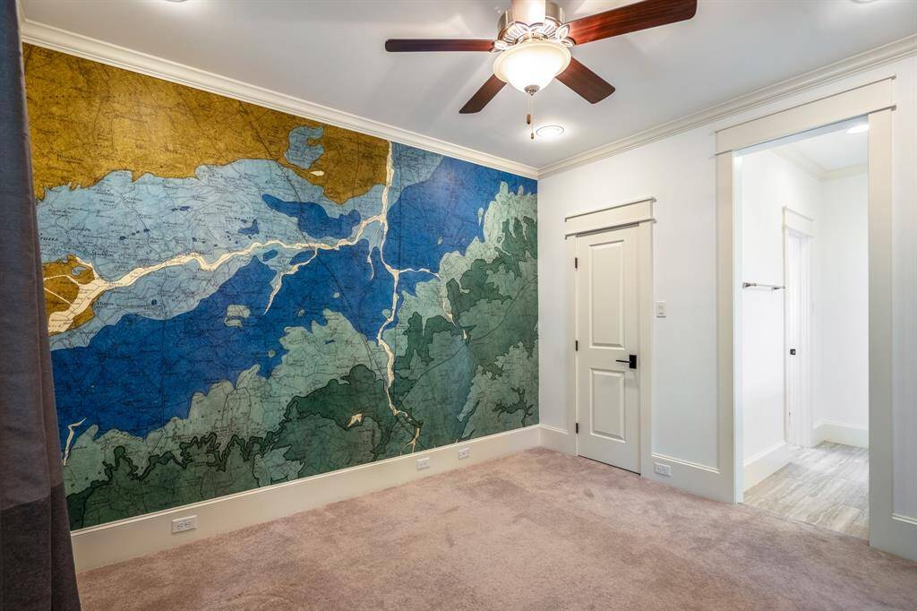 With a wall-sized map mural and ample natural light, this bedroom becomes an imaginative haven for curious young minds or a stylish guest retreat.