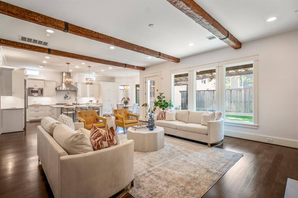 An open-concept floorplan brings the living room, kitchen, and dining spaces together in seamless harmony, creating the ideal environment for modern family life.