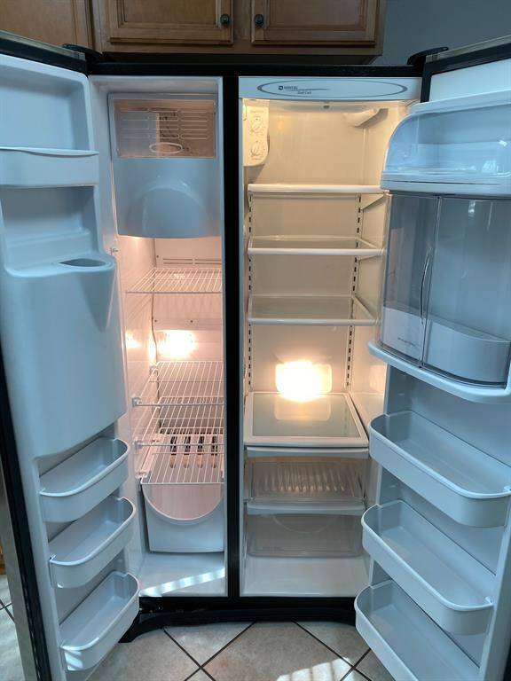 Side by side stainless steel refrigerator
