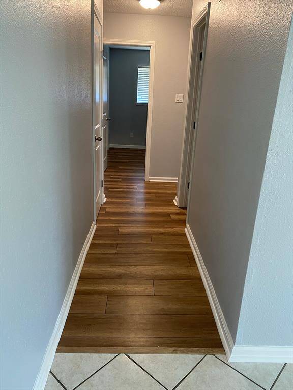 Hallway to the 3 bedrooms