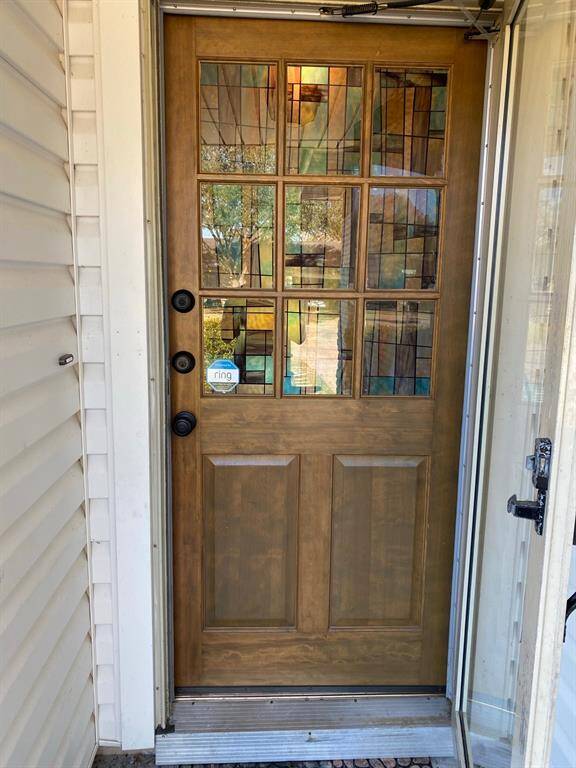 Beautiful wood door with stained glass windows for privacy