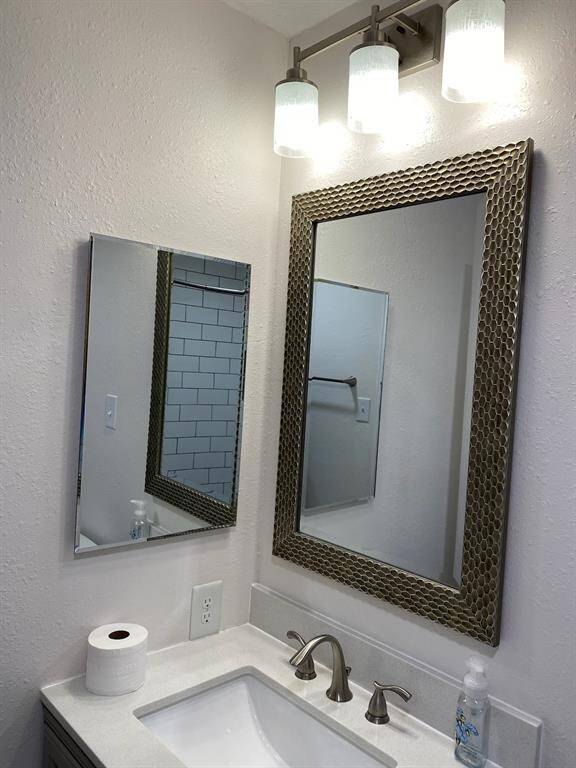 Light fixtures and mirrors updated