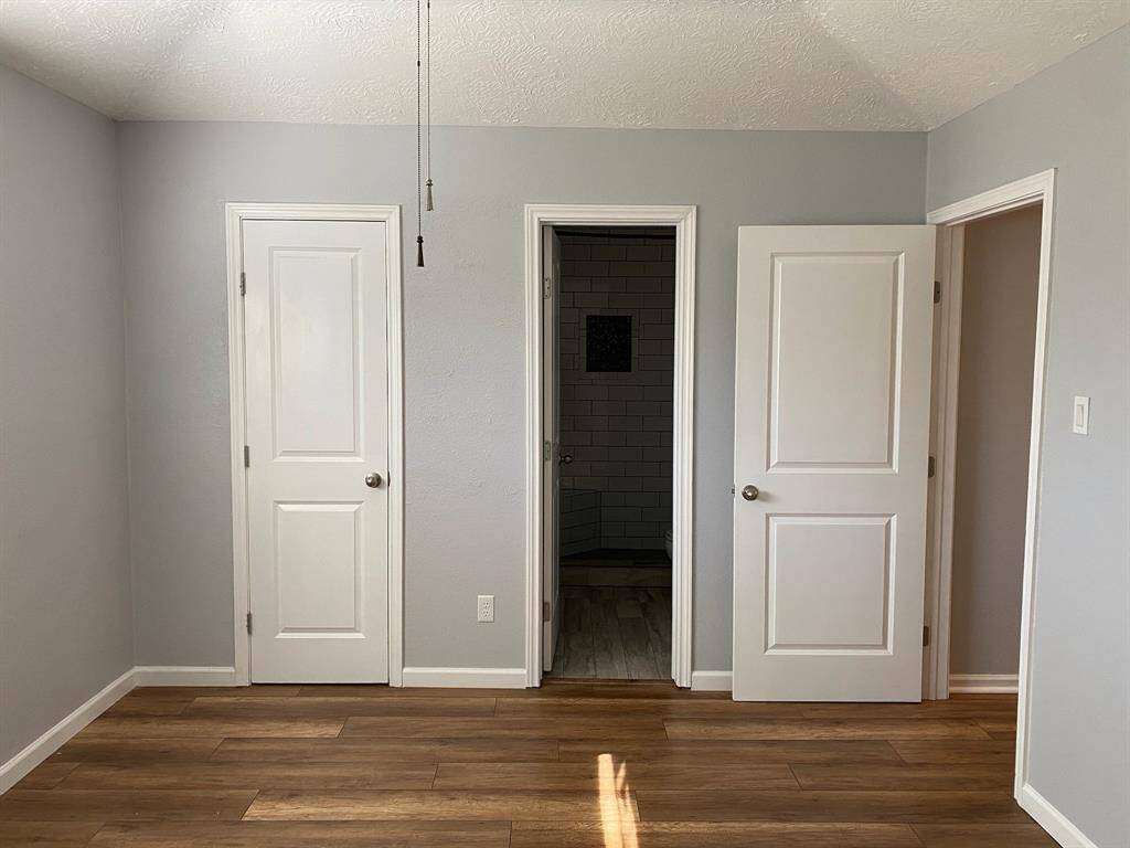 Primary bedroom with vaulted ceilings
