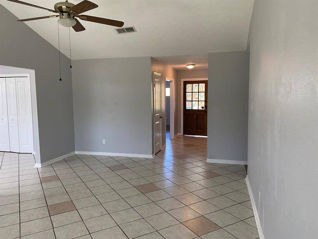 Living room has vaulted ceilings