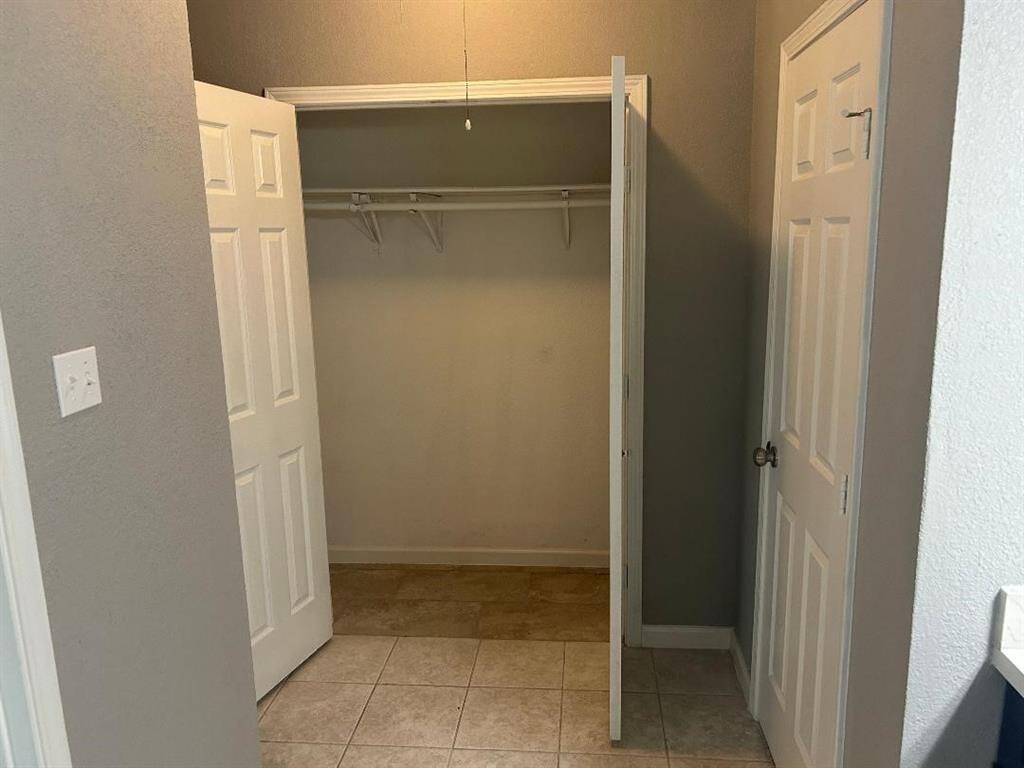 Closet space with double doors in Master bedroom.