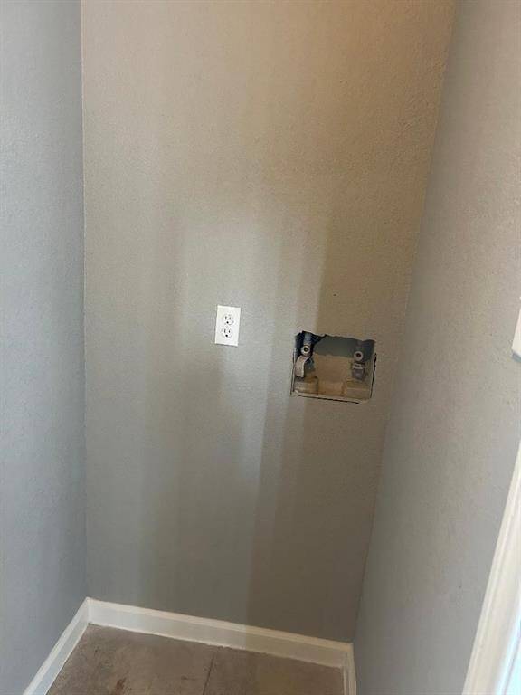 Laundry area with hookups for a washer connection.
