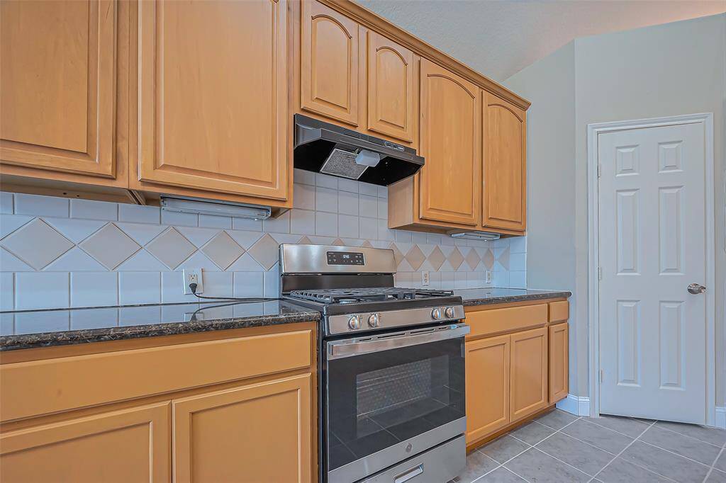 Open concept kitchen with stainless steel appliances