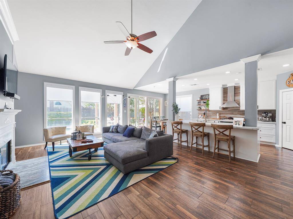 Experience the epitome of modern living in this stunning home featuring a gorgeous, open-concept main living area. The family room seamlessly flows into the updated gourmet kitchen and breakfast area, creating a perfect space for both entertaining and everyday living.