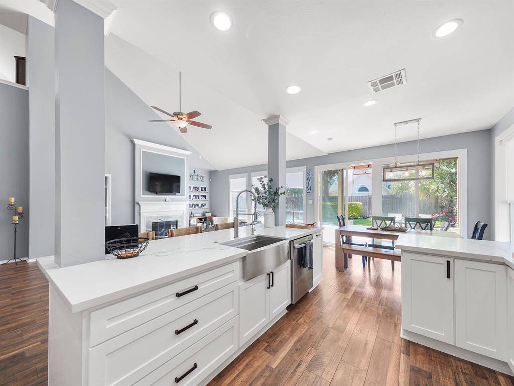 The stainless steel apron farmhouse sink is the perfect addition to this kitchen.