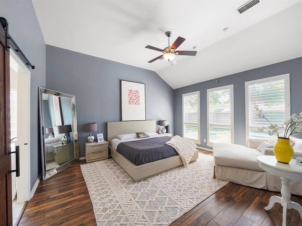 Welcome to a haven of tranquility. This gorgeous primary retreat offers an escape from the everyday with its high ceilings, soothing color palette, and elegant plantation shutters that adorn the large windows. The updated ensuite bathroom provides a spa-like experience.