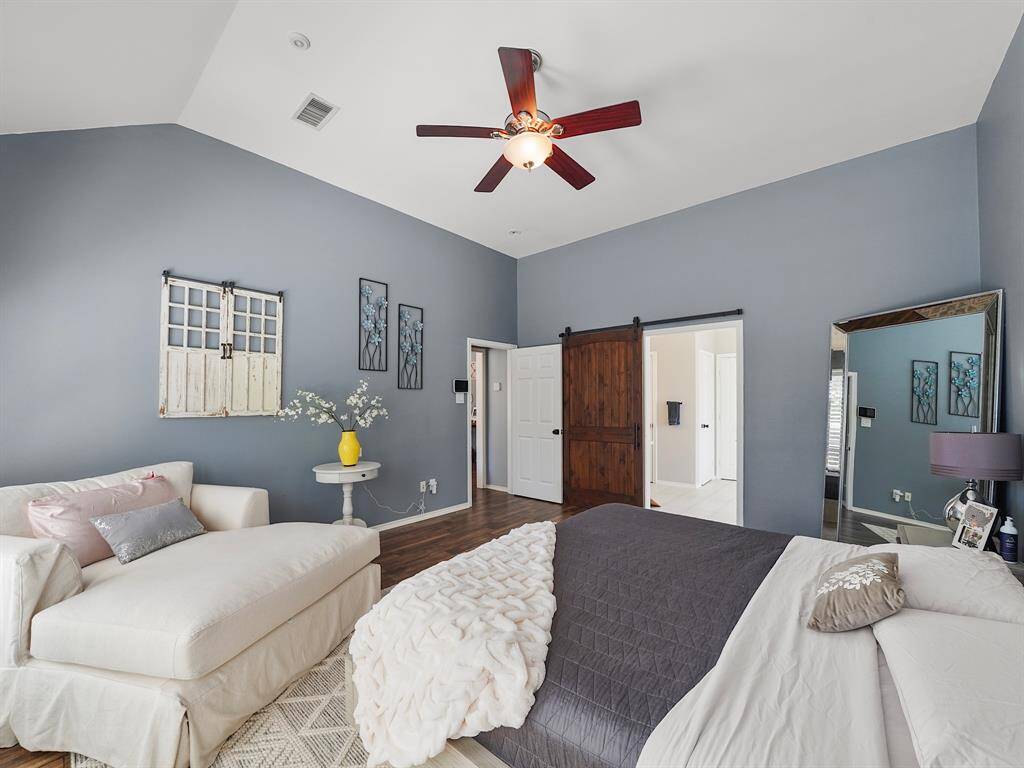 Charming details abound in this exceptional property, including a stylish sliding barn door that adds a touch of rustic warmth and character to the luxurious primary retreat.