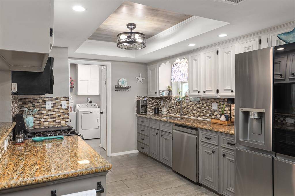 Kitchen with granite counters.