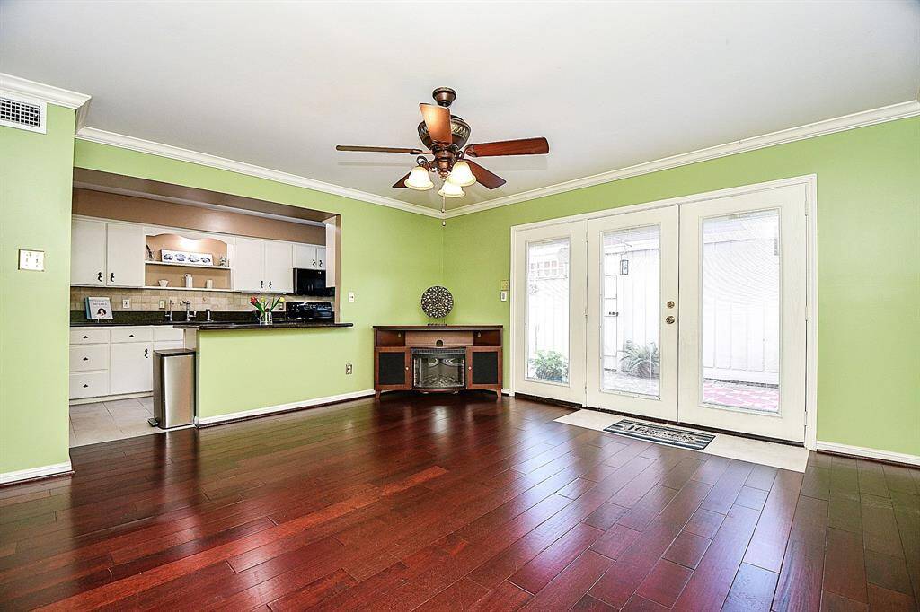 The corner fireplace is actually considered furniture and is a separate piece.  It's electric and included with this lovely townhome!  However, it may be removed upon request.