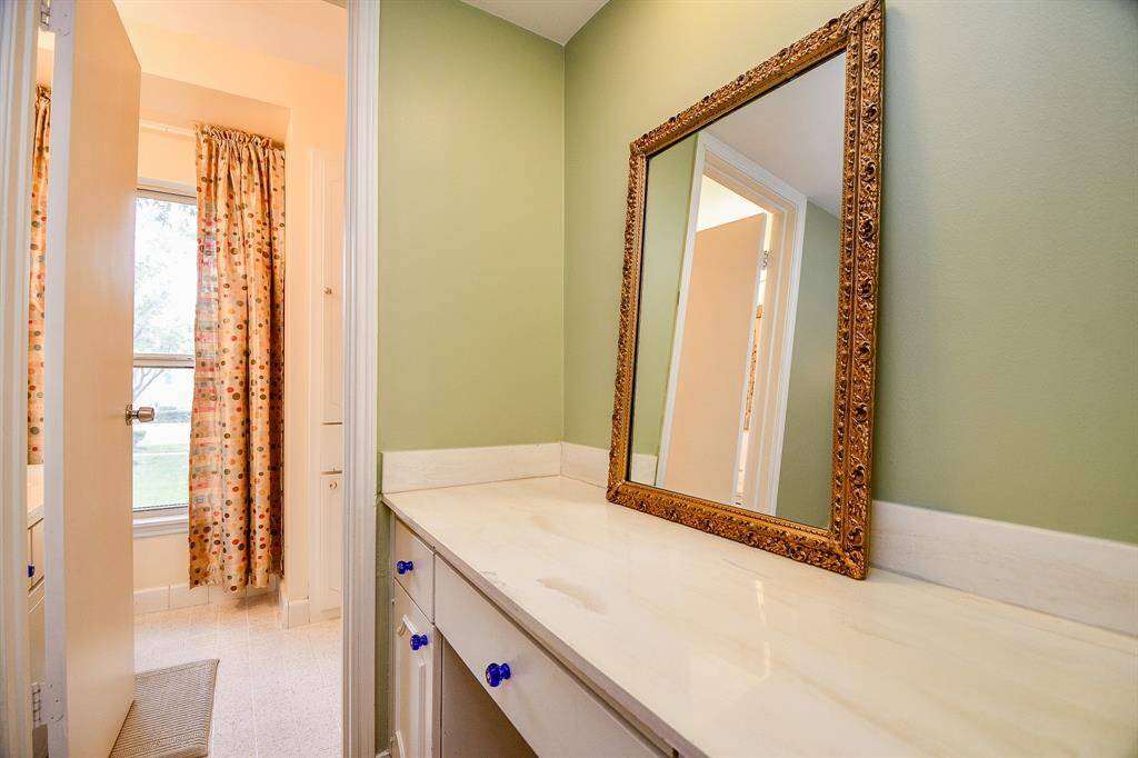 Convenient vanity adjacent to the primary bath.
