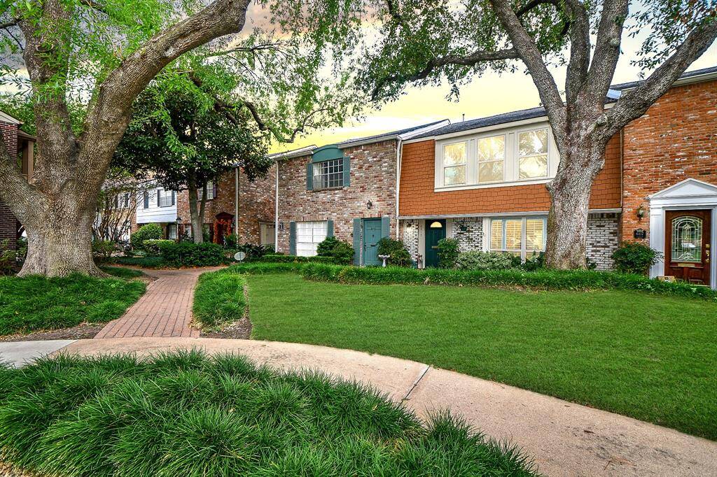 Lovely brick paver walkways and lush landscaping.